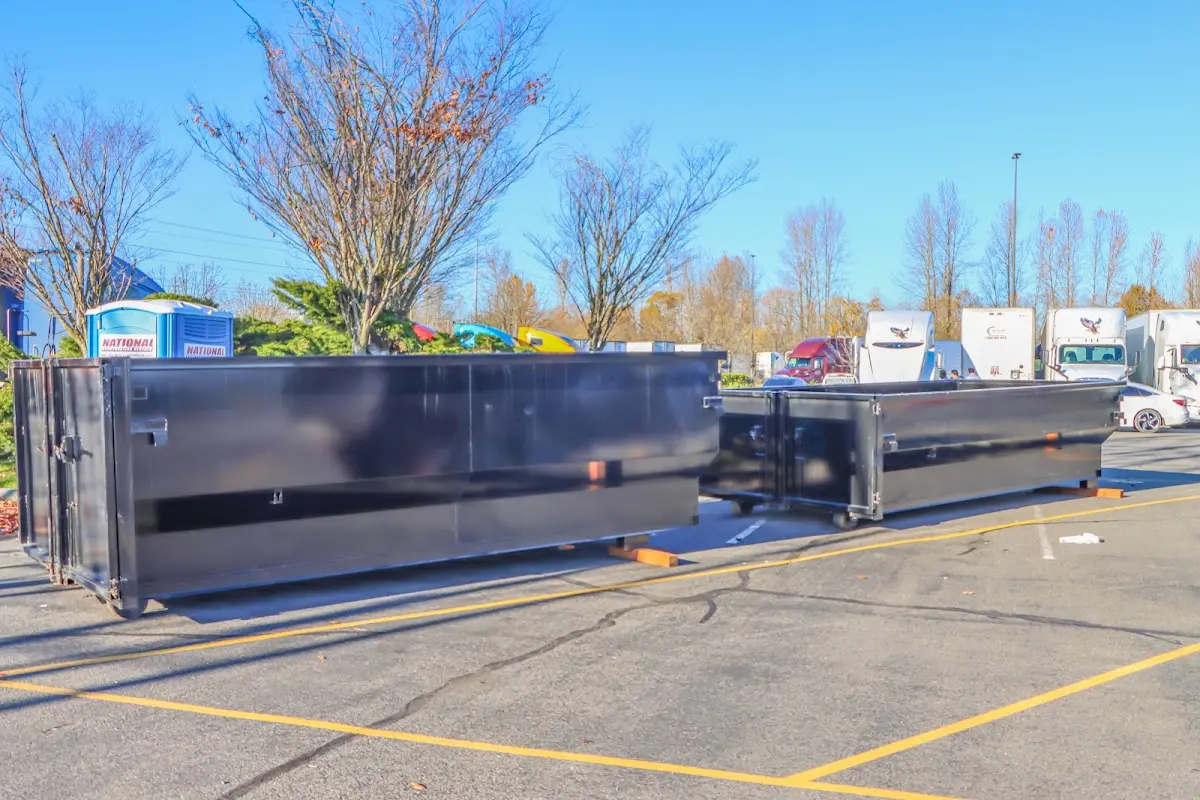 Professional dumpster rental service with roll-off container on residential driveway in Grovetown